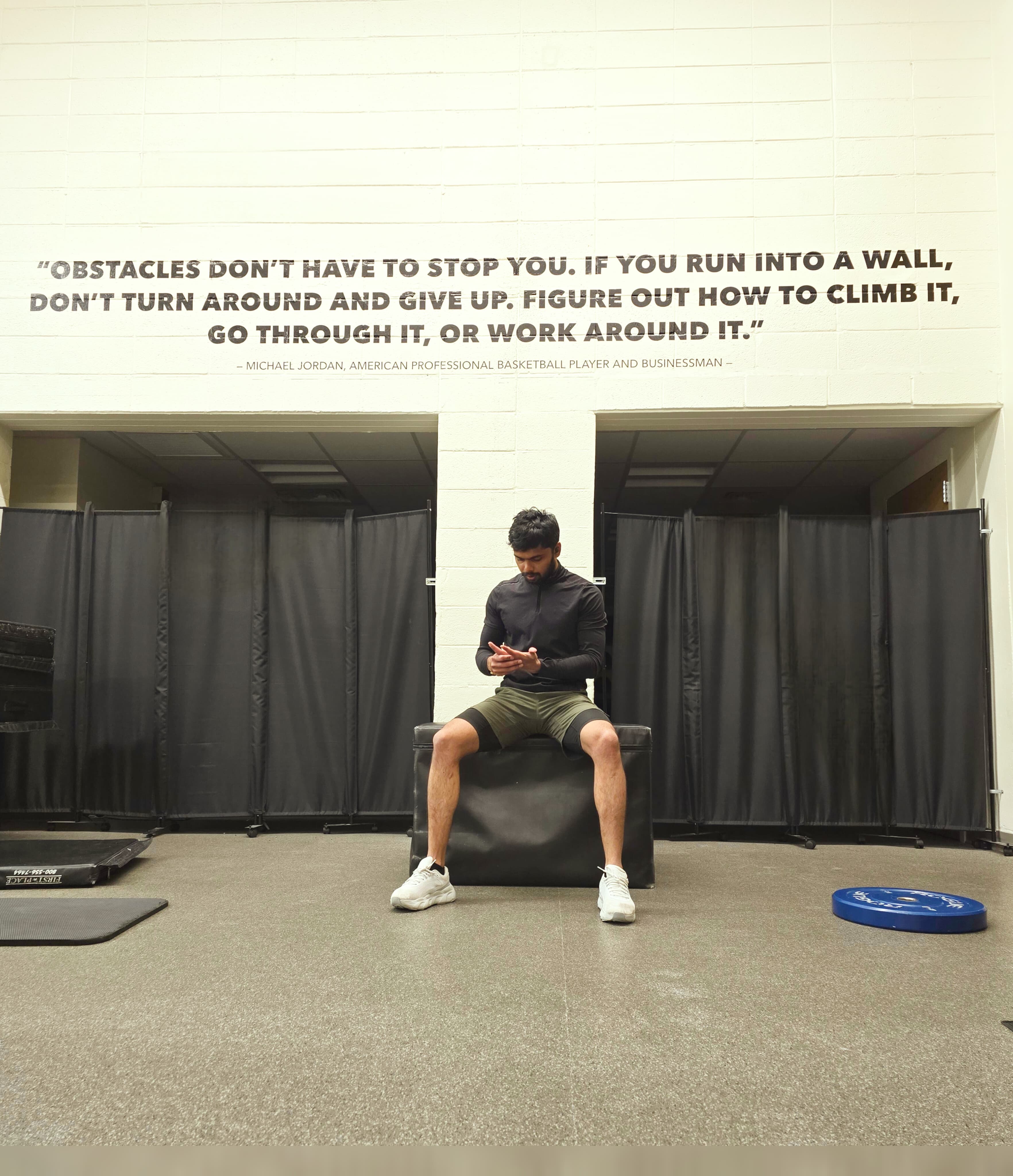 Srujan training in the gym under a Michael Jordan quote